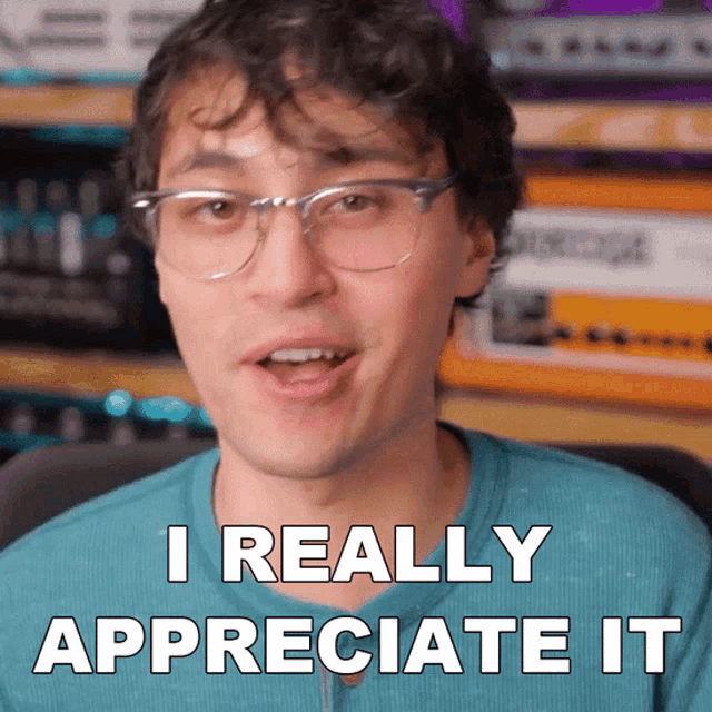 a man wearing glasses and a blue shirt says i really appreciate it