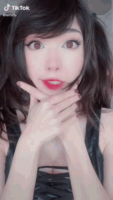 a woman 's face is shown in a tik tok video