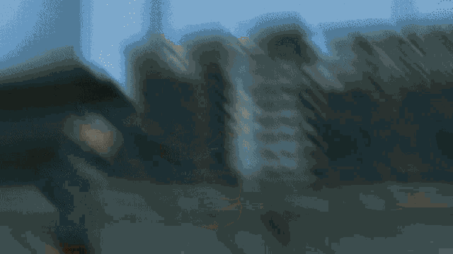 a blurry picture of a person walking in the street