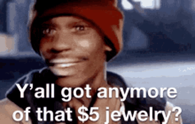 a man wearing a red hat is smiling and says y all got anymore of that $ 5 jewelry ?