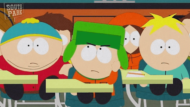 a group of south park characters sitting at desks