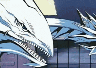 two white dragons are fighting each other in a building .