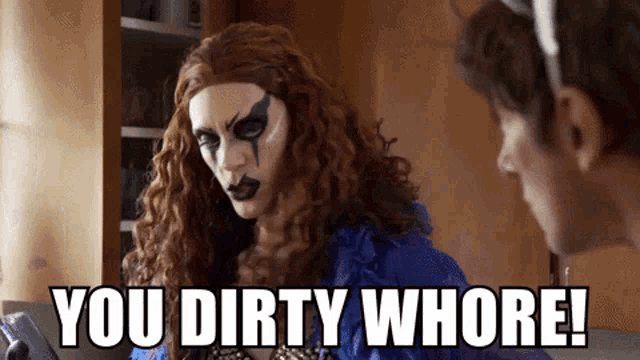 a drag queen says " you dirty whore " while looking at a man