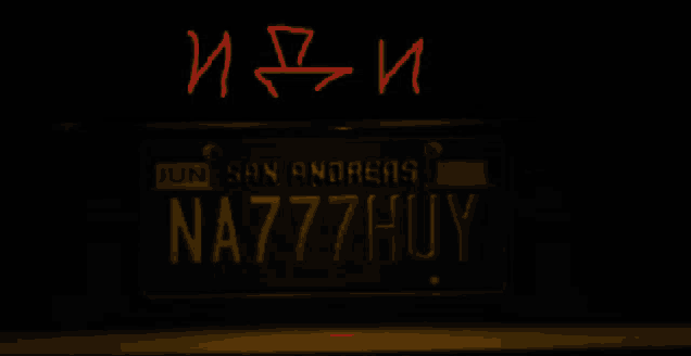 a yellow car with a license plate that says na777huy on it