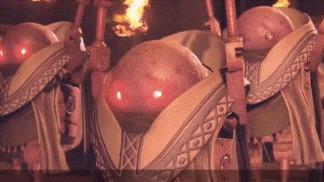 a blurred image of a group of robots with red lights