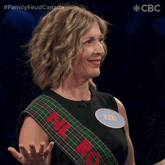 a woman wearing a sash that says nl ro on it