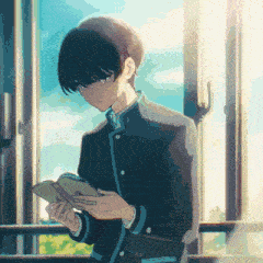 a pixelated image of a boy reading a book