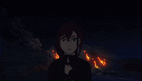 a silhouette of a person in front of a explosion