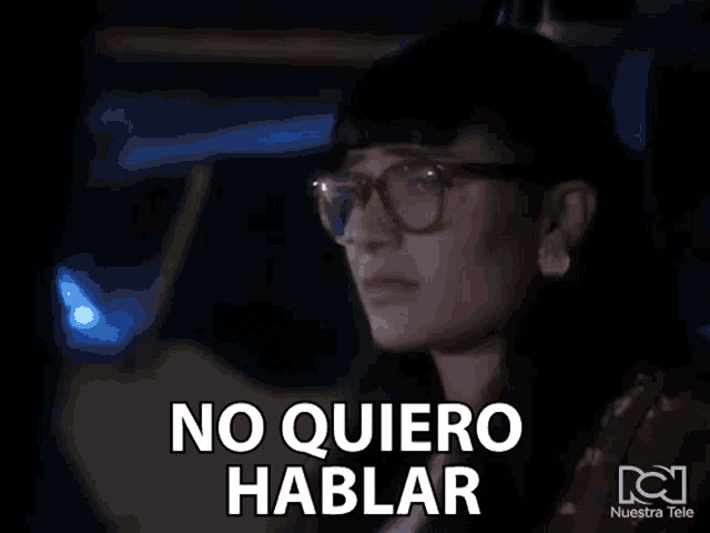 a woman wearing glasses and earrings says no quiero hablar