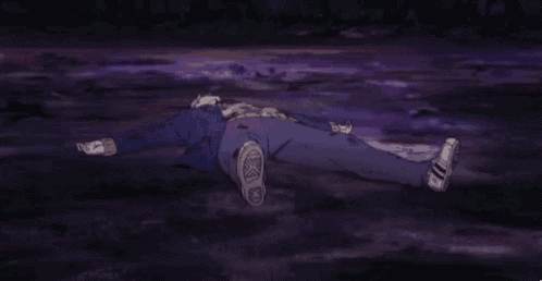 a man is laying on the ground with blood coming out of his pants