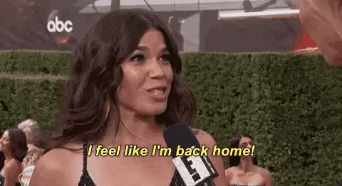 a woman is talking into a microphone and saying `` i feel like i 'm back home ''