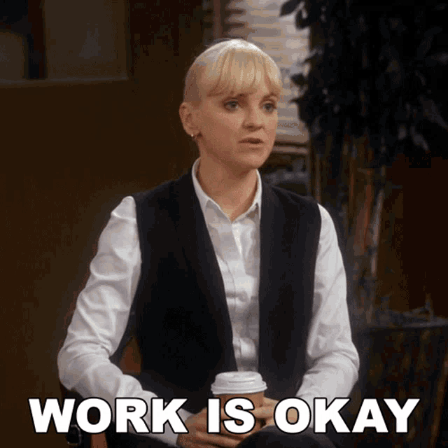 a woman sitting in a chair with a cup of coffee and the words work is okay below her