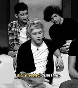 a group of young men are sitting on a couch with one saying niall ( troubled ) jesus christ