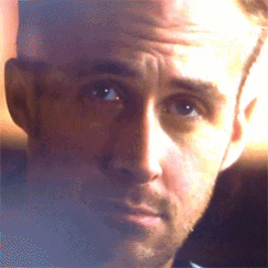 a close up of a man 's face with a wrinkled forehead