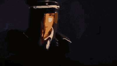a close up of a person 's face with a red light coming out of it