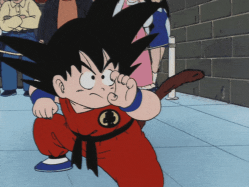 a cartoon character named goku is wearing a red jumpsuit