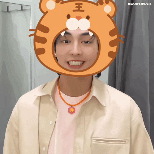 a man wearing a tiger mask with the word heartchu.gif on the bottom right