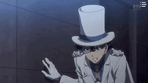 a man in a top hat and gloves is standing in a dark room .