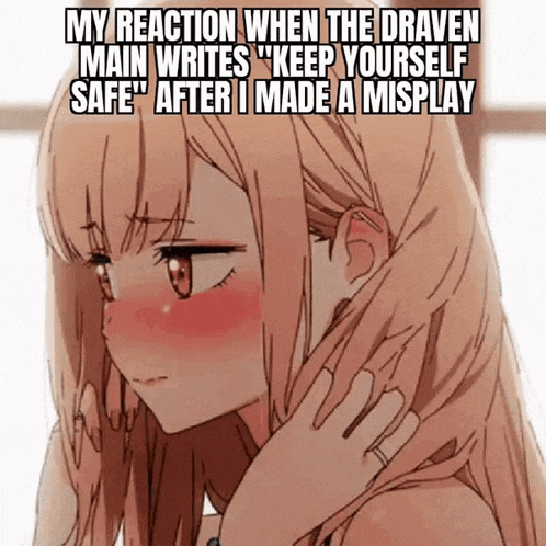 a girl with long blonde hair is making a funny face while holding her hair .