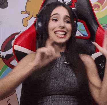 a woman wearing headphones with the number 3 on the back