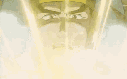 a man with a beard is standing in front of a table with light coming from it .