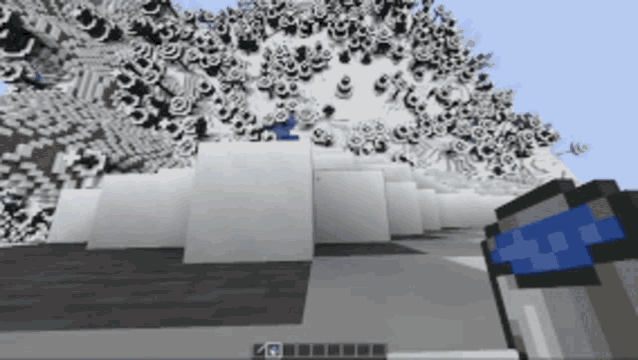 a bucket of water is in front of a snowy mountain