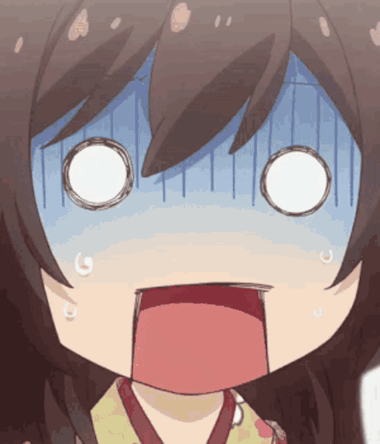 a close up of a girl 's face with a surprised look on her face