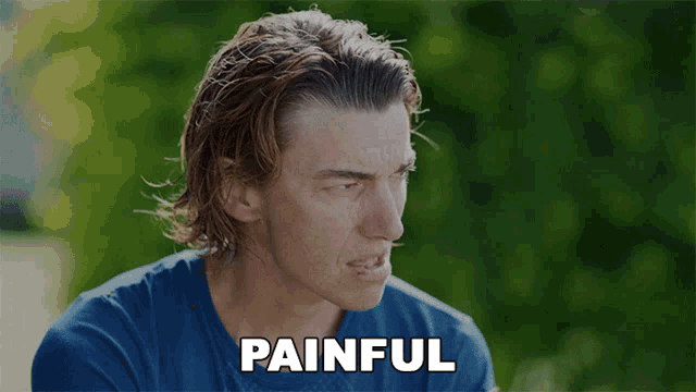 a woman in a blue shirt says painful in white letters on a green background