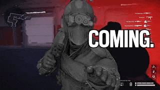 a man in a military uniform is holding a gun and pointing at the camera with the words `` coming '' .
