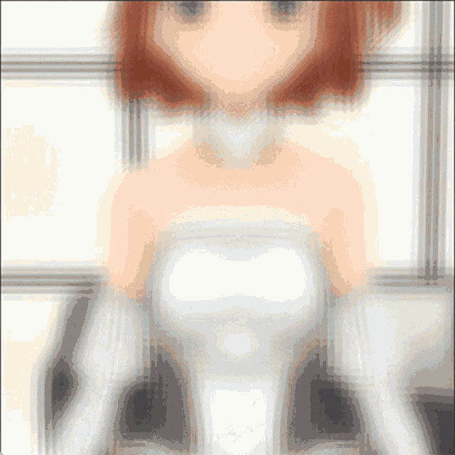 a blurry picture of a girl with red hair wearing a white dress
