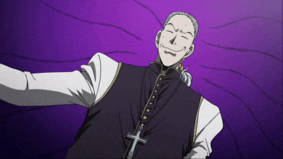 a man with a cross on his chest is smiling