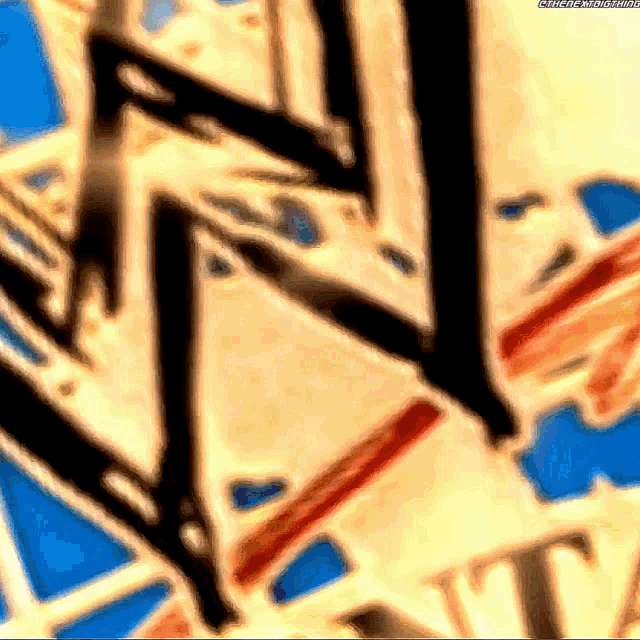 a close up of a painting with the letters w and t
