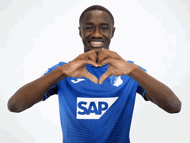 a man wearing a blue shirt that says sap on it