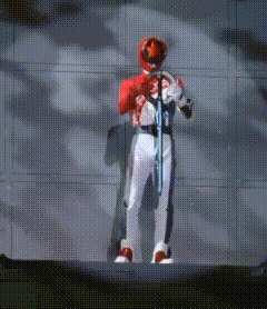 a man in a red helmet and white pants is holding a sword .