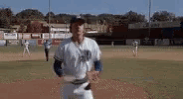 a man in a baseball uniform is running on the field