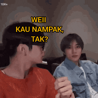 two young men are sitting next to each other and one of them is asking the other " weil kau nampak tak "