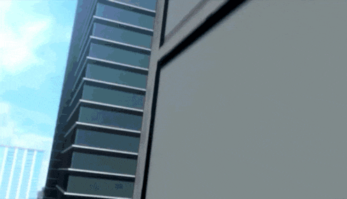a building with a lot of windows and a blue sky behind it