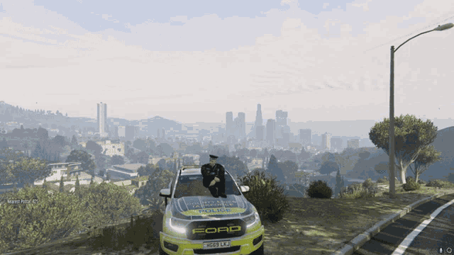 a ford police car is parked on a hill