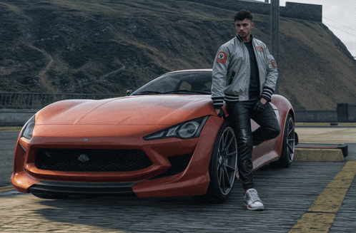 a man in a bomber jacket is standing next to an orange car