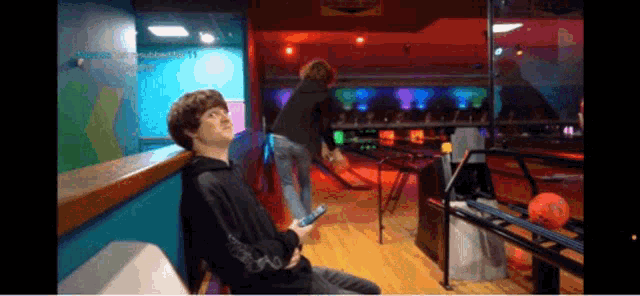 a bowling alley has a sign that says " bowling " on it