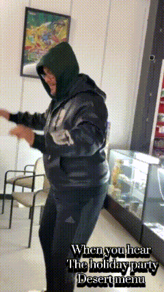a man in a hoodie is dancing in a room with the words " when you hear the holiday party desert menu " above him