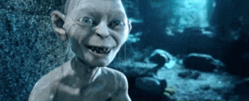 a gollum from the lord of the rings looks at the camera