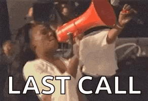 a woman is holding a megaphone in her hand and shouting .