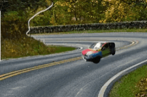 a colorful car is driving down a road