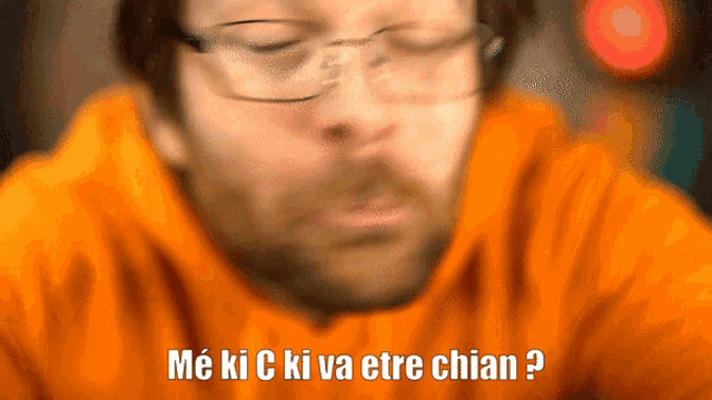 a blurry picture of a man with the words me ki c ki va etre chian on the bottom