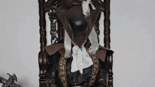 a person in a pirate costume sits in a chair