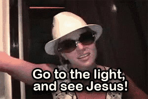 a woman in a hat and sunglasses is saying `` go to the light and see jesus '' .