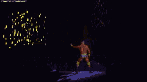 a man without a shirt is standing in front of a screen with a lot of lights on it .