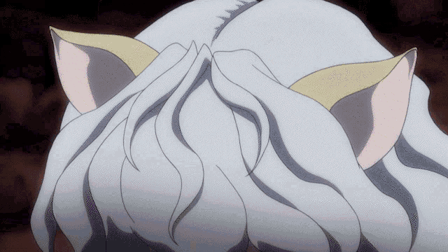 a close up of a person 's hair with cat ears on it