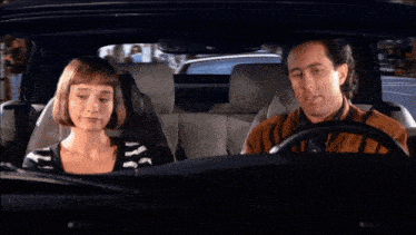 a man and a woman in a car with the words he was a very bad dictator on the screen